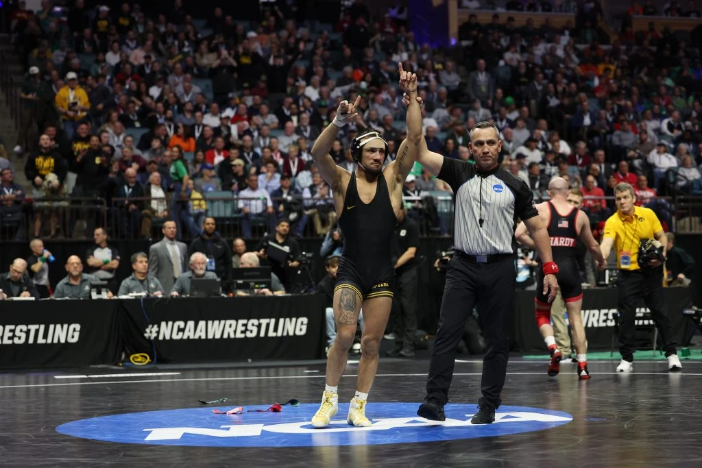 Iowa senior Real Woods advances to NCAA finals; Spencer Lee upset in