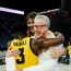 Fran McCaffery, Owen Freeman and Drew Thelwell hug after win
