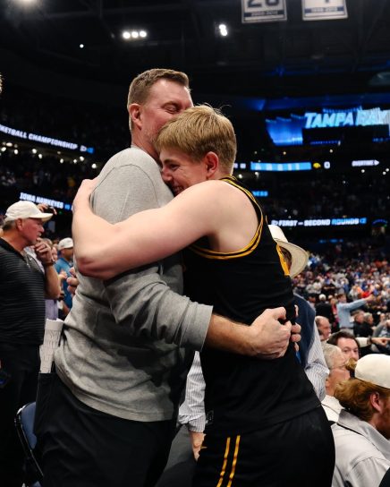 koch father son embrace