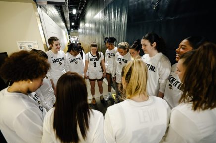 women pregame huddle