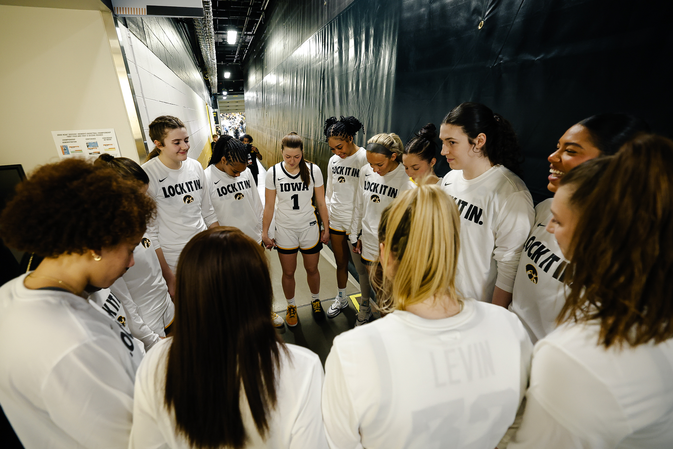 women pregame huddle