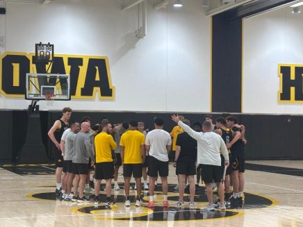 men hoops practice huddle