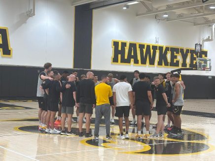 men practice huddle
